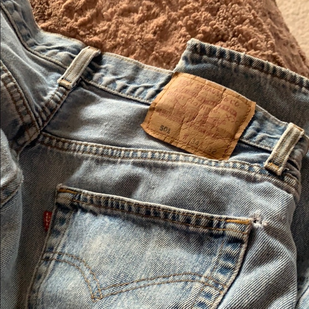 Levi’s high waisted bell bottom ripped blue jeans